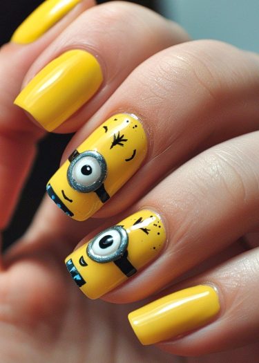 Vibrant Minion-themed nail art features colorful designs on glossy yellow polish.